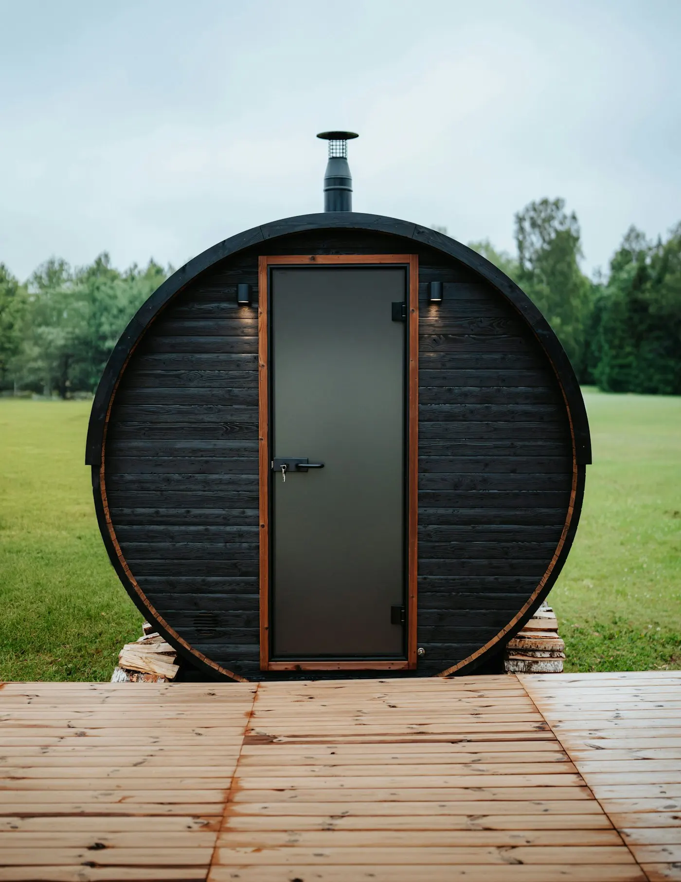 Barrel sauna with a chimney outdoors